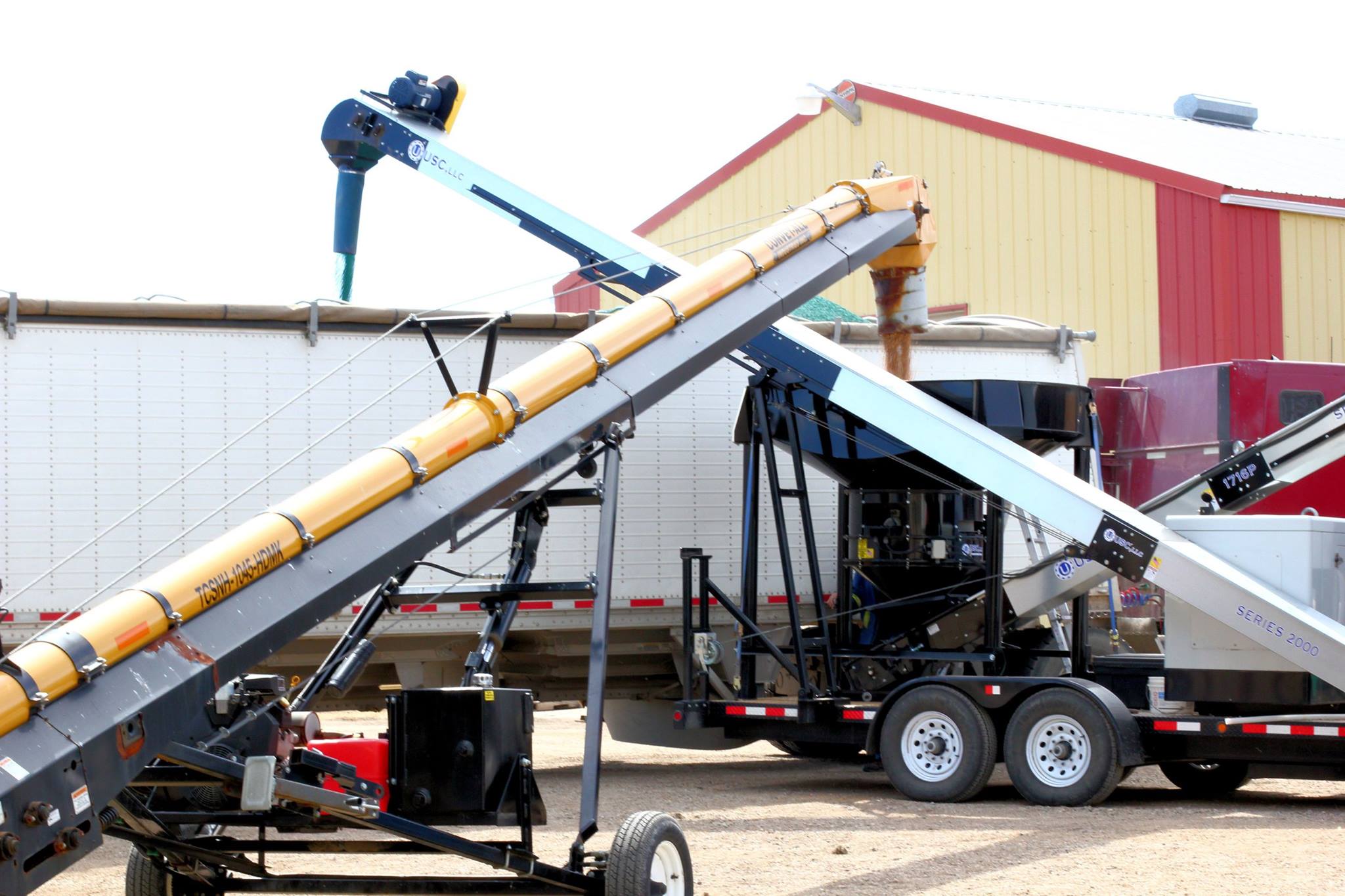 Agricultural equipment in operation at Super Seed, showing grain conveyor unloading material, highlighting its services as an agriculture company in Yellow Grass, Saskatchewan.